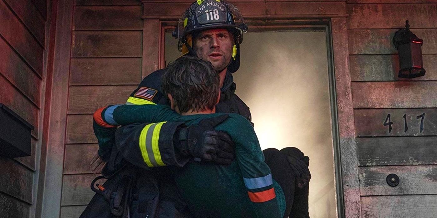 A firefighter carrying a survivor in 9-1-1