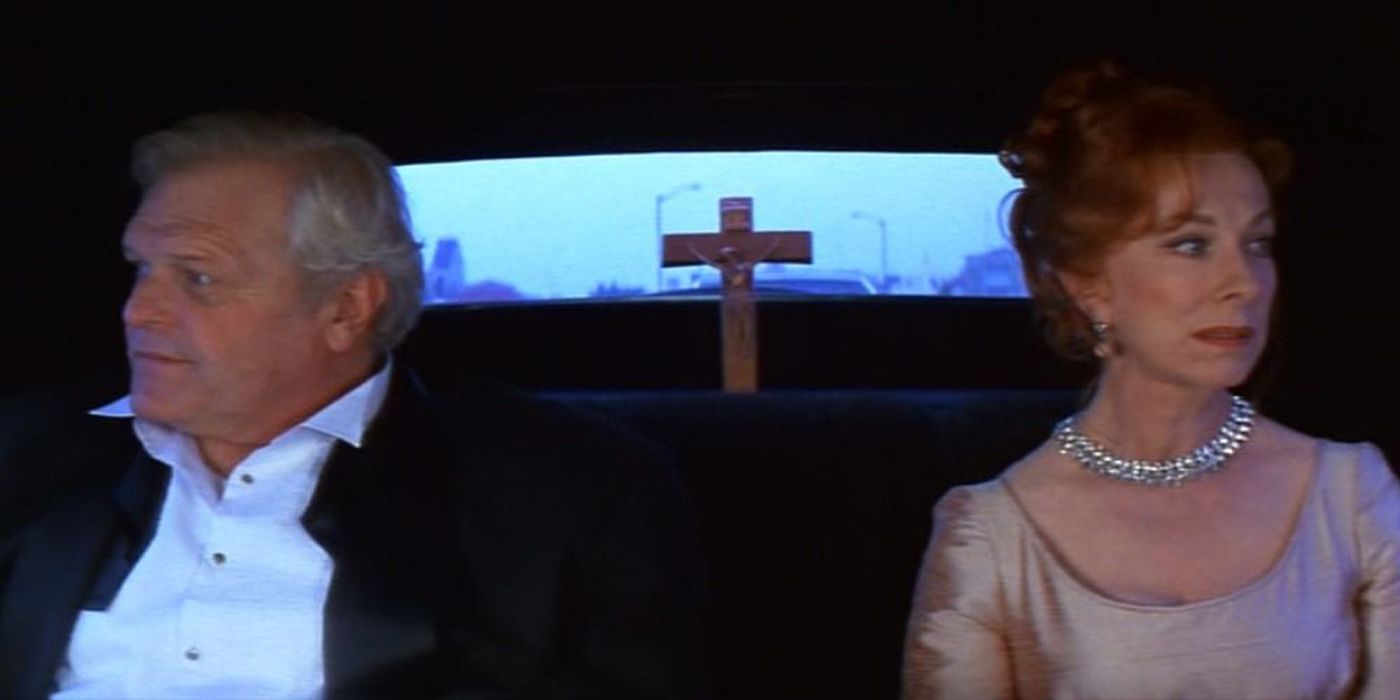 An image of Lord and Lady Montague sitting in a limo together in Romeo + Juliet