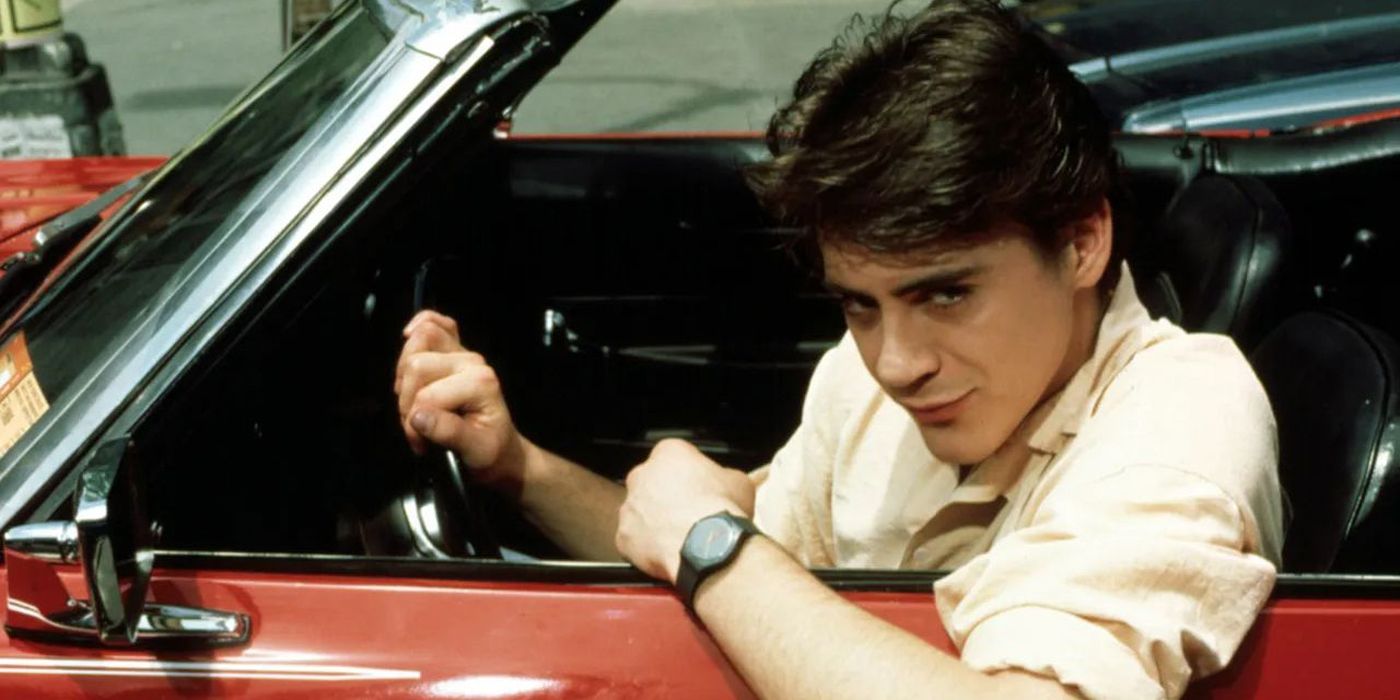 An old picutre of actor Robert Downey Jr. in a classic car