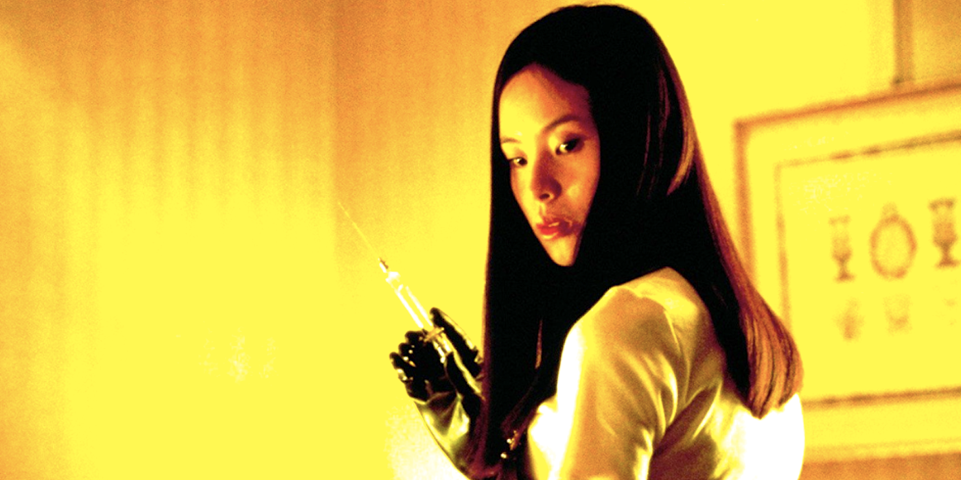 Eihi Shiina as Asami Yamazaki holding a syringe in Audition
