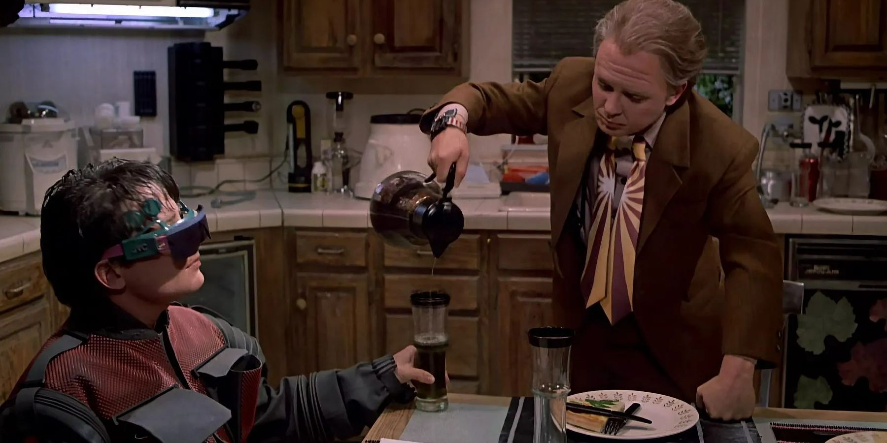 Marty McFly pours a drink for his son Marty McFly Jr. in Back to the Future 2.