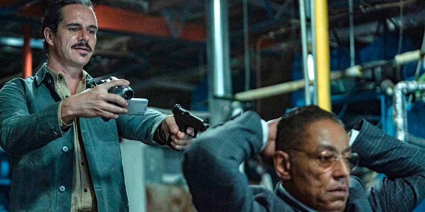 Lalo pointing a gun and video camera at Gus in Better Call Saul season 6