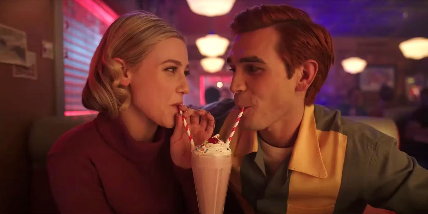Betty and Archie sharing a milkshake on Riverdale
