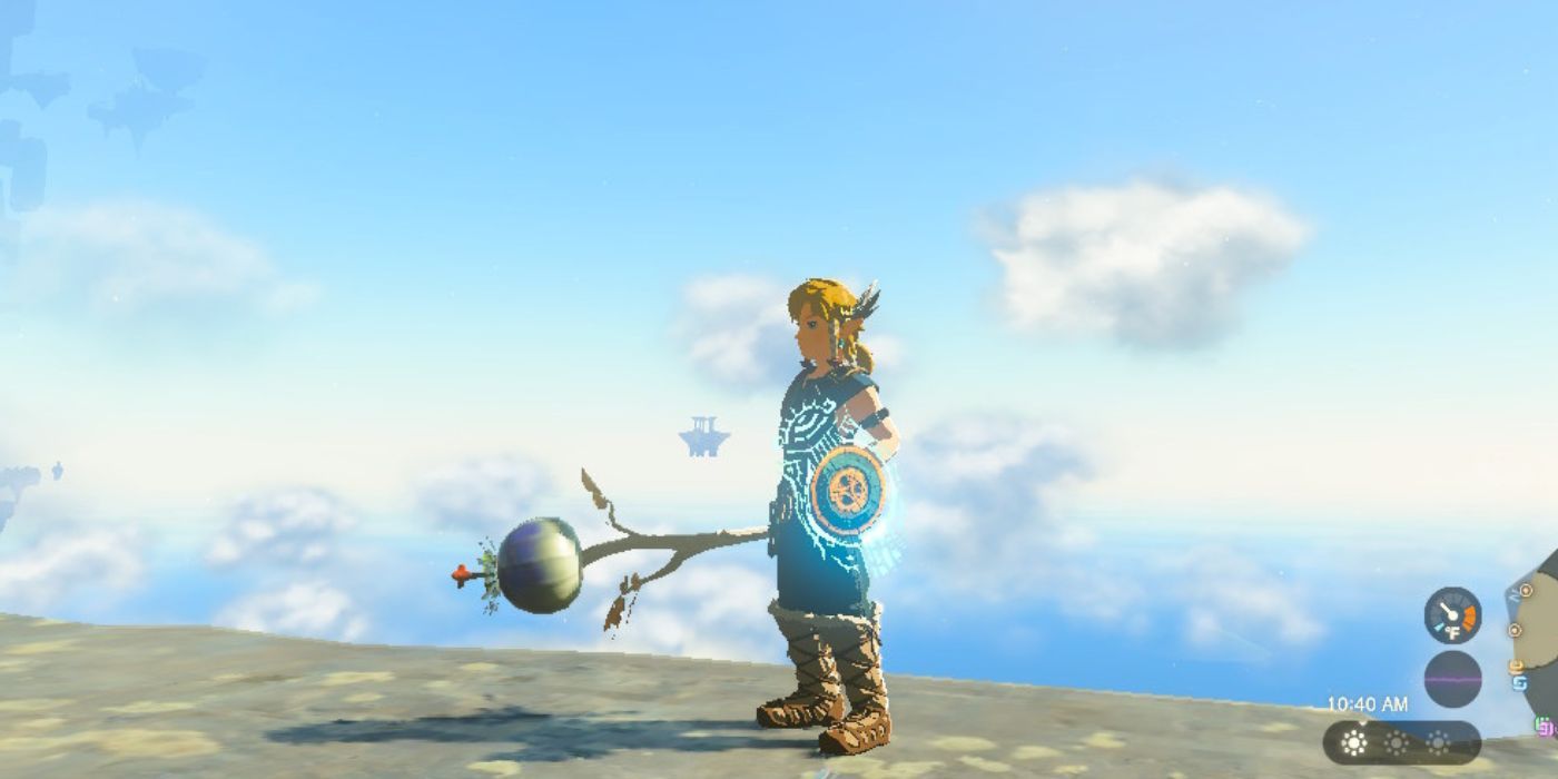 Link segurando uma Bomb Flower fundida a um bastão em Tears of the Kingdom.