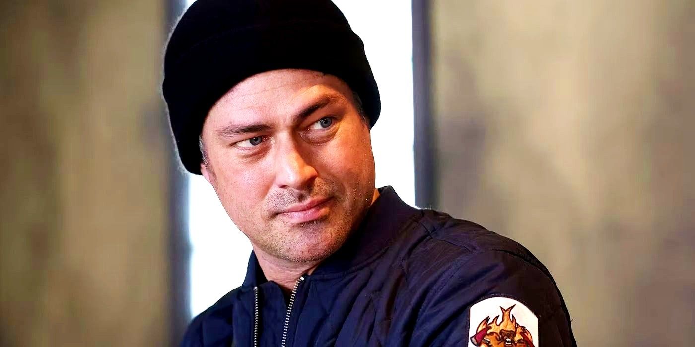 Taylor Kinney as Kelly Severide looking over his shoulder and wearing a beanie in Chicago Fire