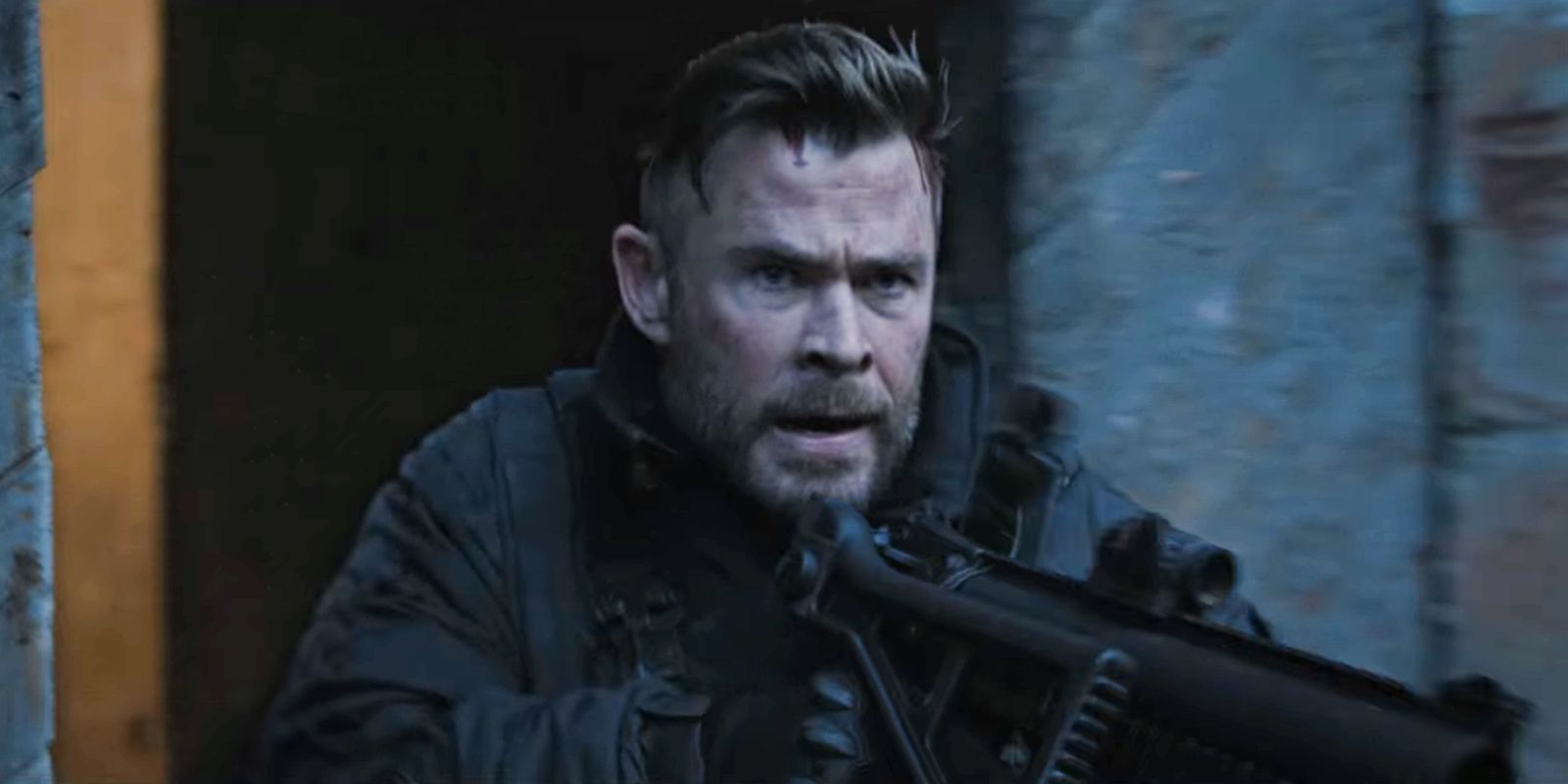 Chris Hemsworth holding a gun as Tyler Rake in Extraction 2.