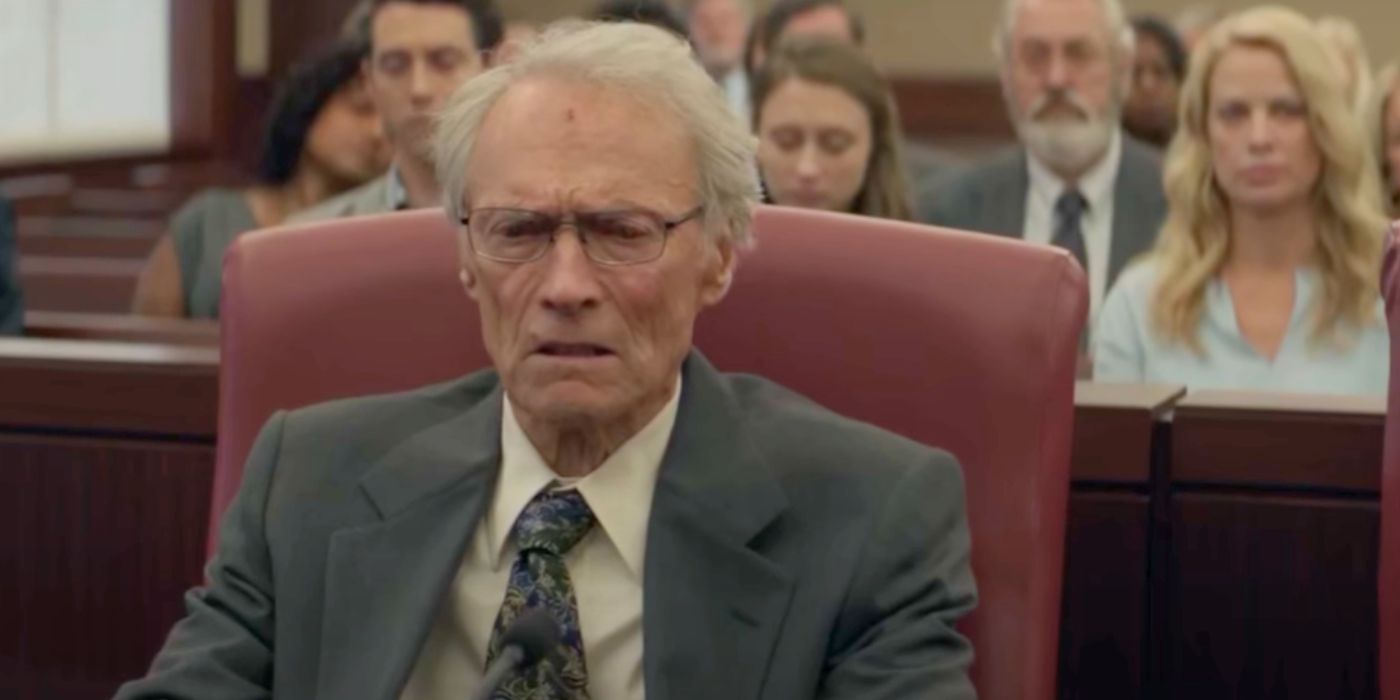 Clint Eastwood looking serious while sitting a courtroom in The Mule