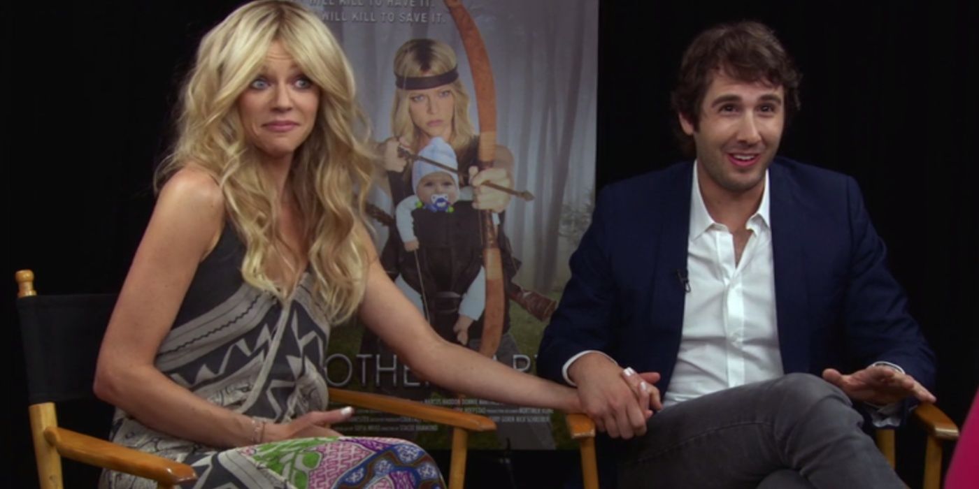 Dee and Josh hold hands during a press junket in It's Always Sunny in Philadelphia