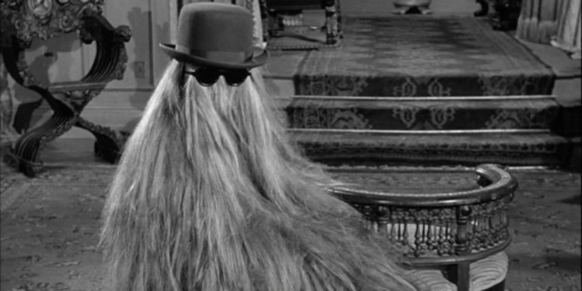 Cousin Itt with his hat and glasses in The Addams Family sitcom