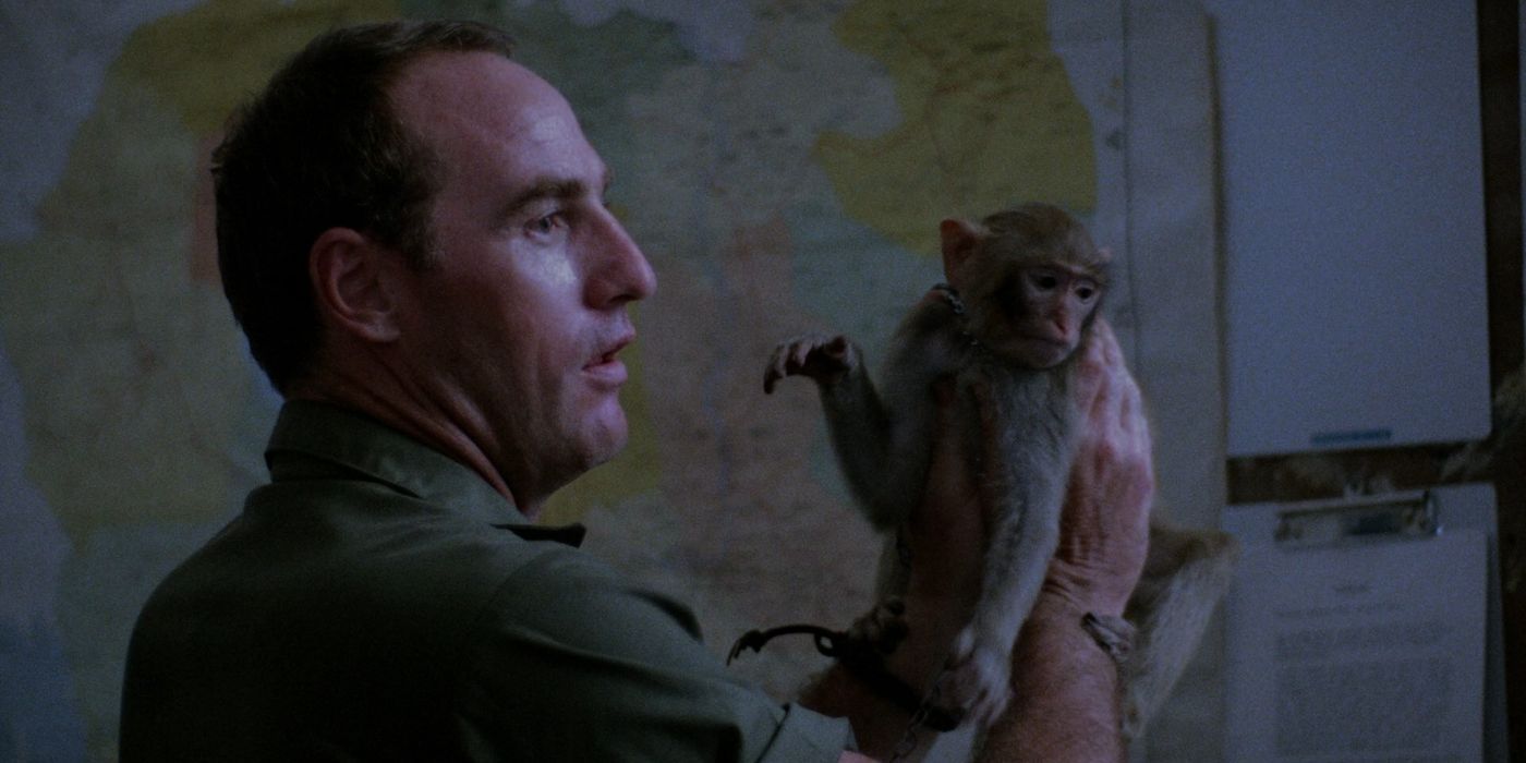 Craig Nelson as a Major holding a monkey in the Killing Fields. 
