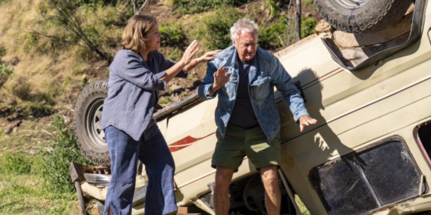 Joan helps Jack Darby out of the wreckage of his car in Darby and Joan