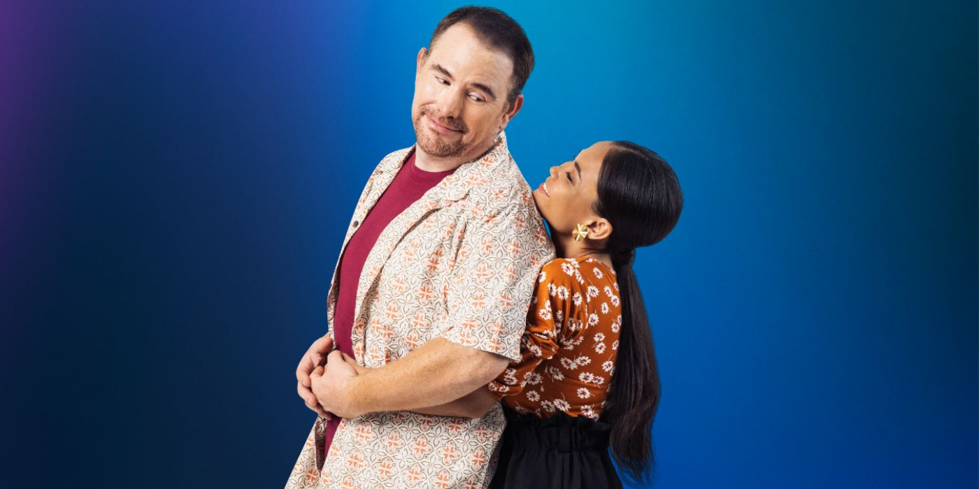 David and Sheila from 90 Day Fiance cuddling in promo photo with blue background