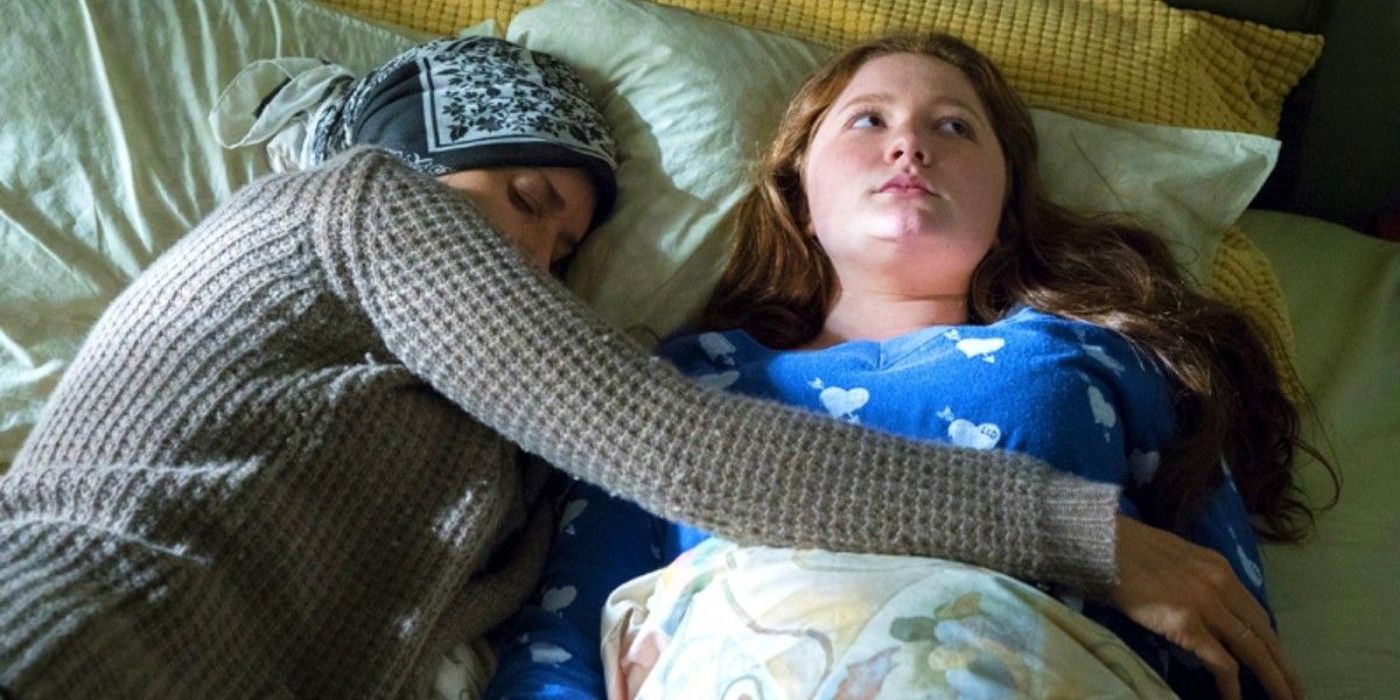 Debbie laying in bed with the married woman on Shameless
