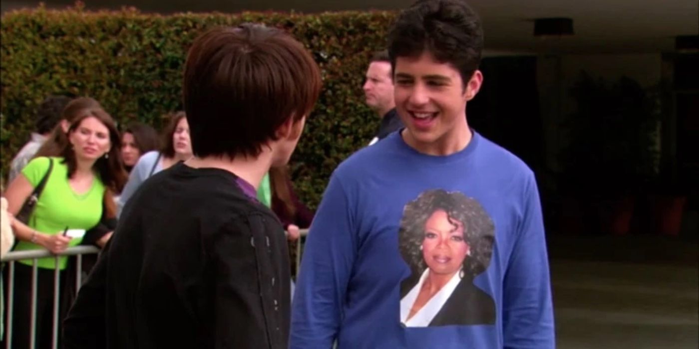 Drake talking to an excited Josh wearing an Oprah t-shirt 