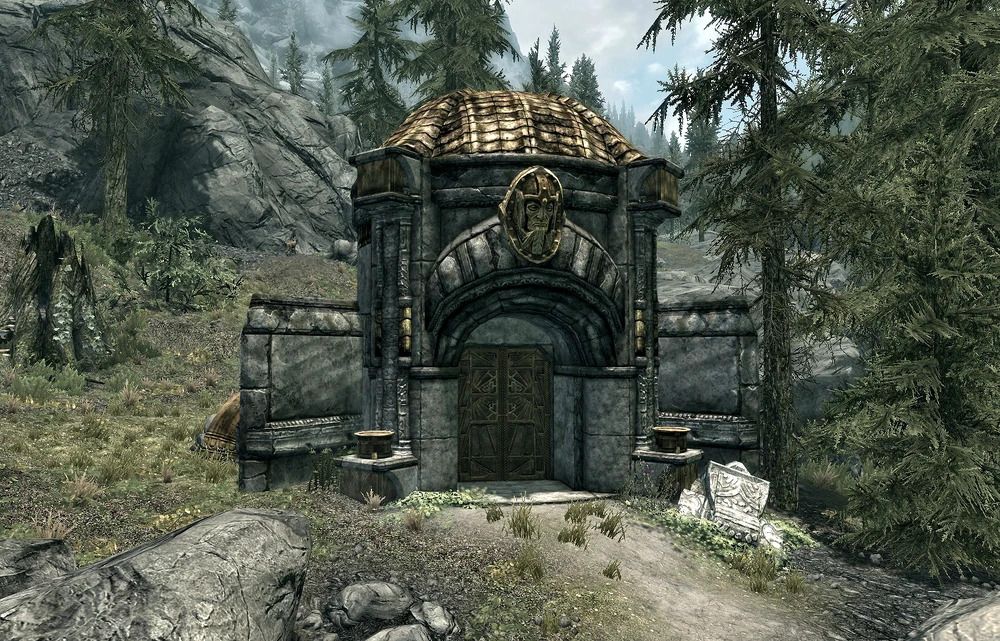 Gudang emas dan abu-abu dengan kepala kurcaci emas di atas pintu masuk, ditemukan di Skyrim.