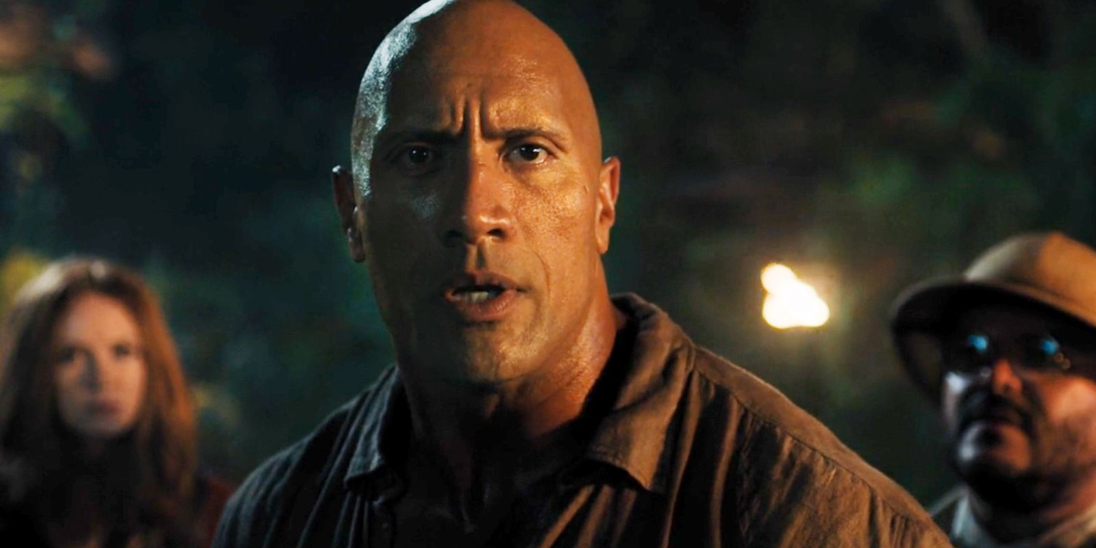Dwayne Johnson stands with cast in Jumanji Welcome to the Jungle