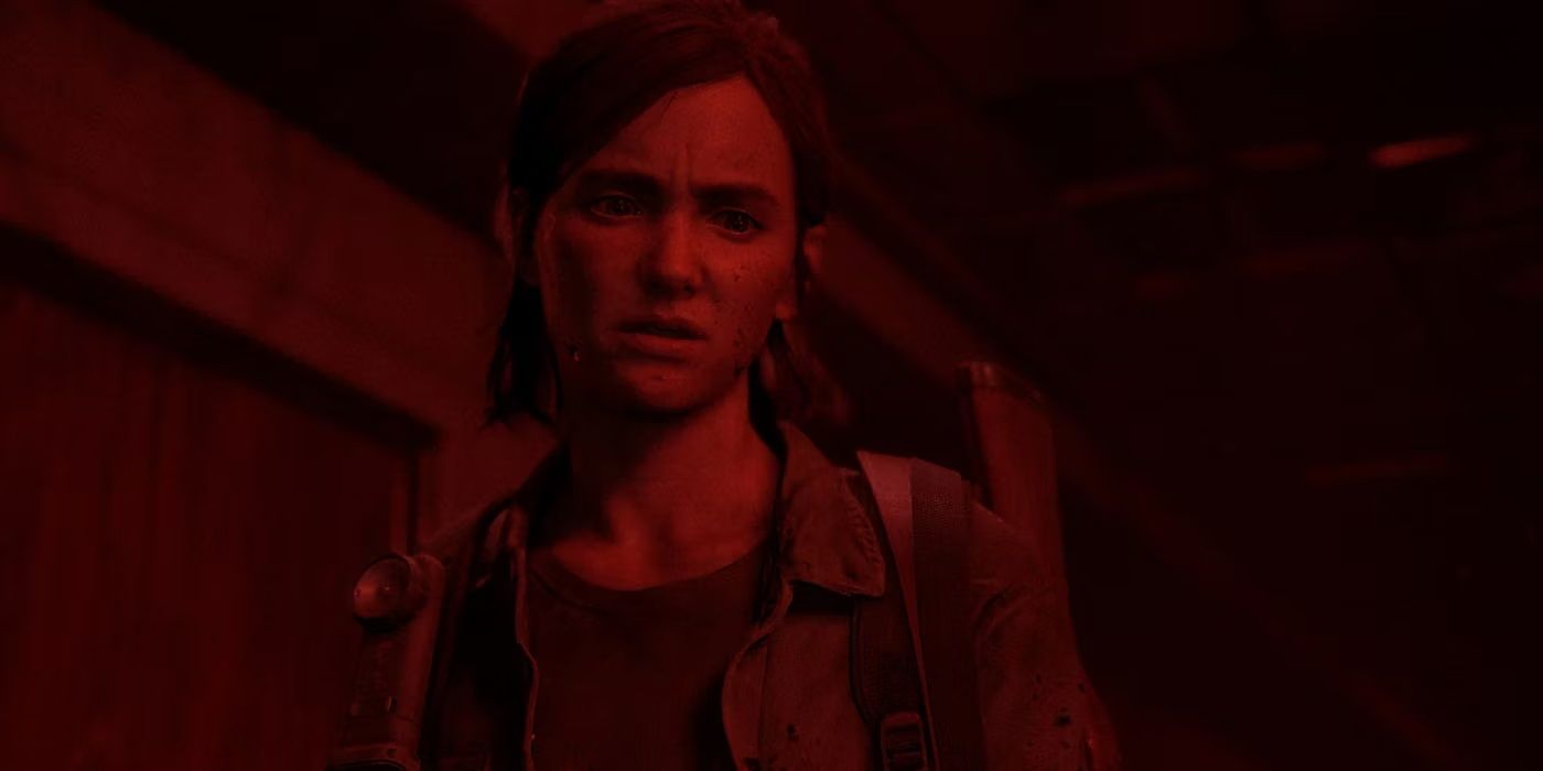 Ellie in red lighting in The Last of Us Part II