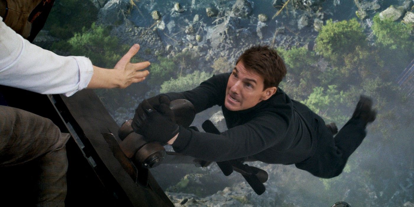 Tom Cruise as Ethan Hunt hanging off a train in Mission: Impossible - Dead Reckoning Part 1