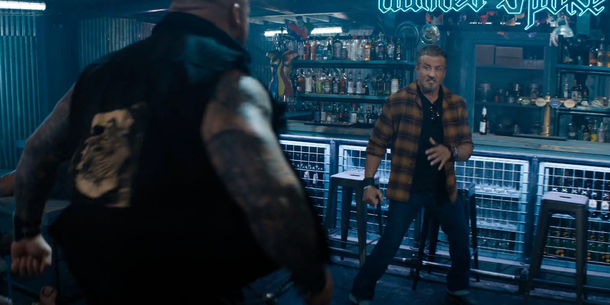 Sylvester Stallone preparing to fight in a bar in The Expendables 4
