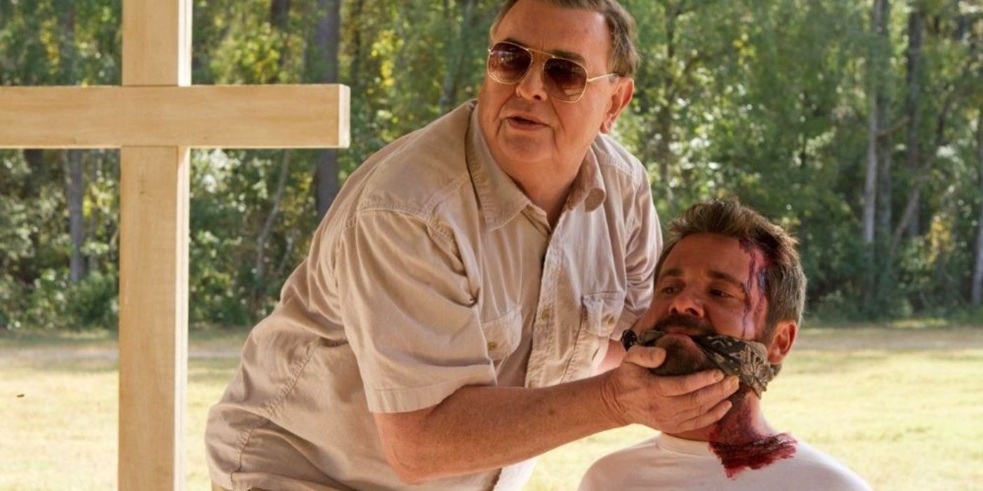 Father gagging Patrick in Ti West's The Sacrament