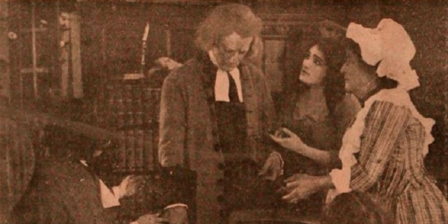 Four people in 19th century clothing in a sepia tone film still from the 1910 Jane Eyre silent movie