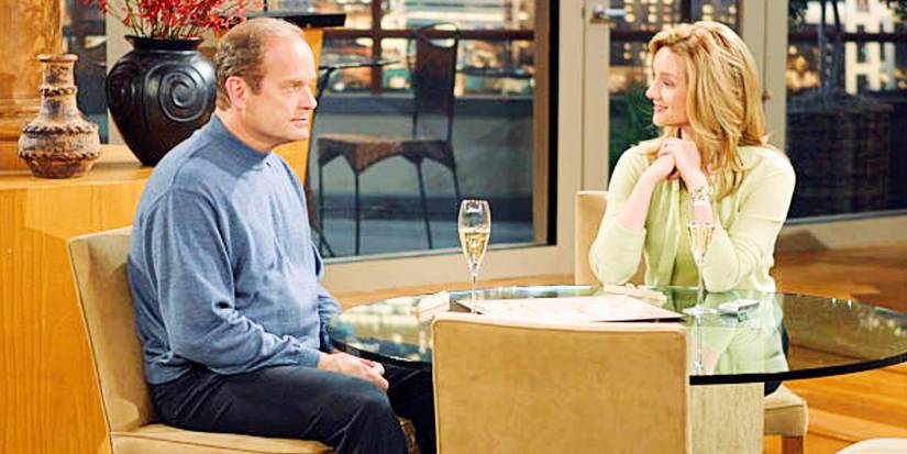Frasier and Charlotte sitting at a table together
