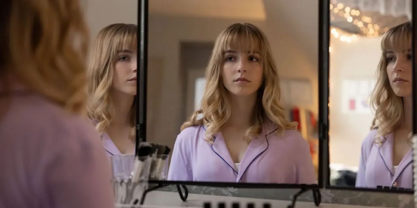 Mckenna Grace looking into a mirror