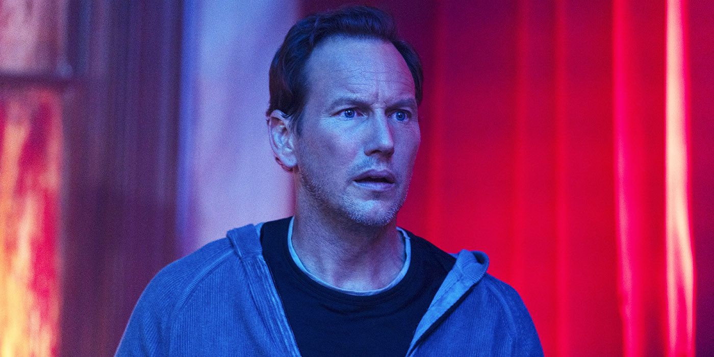 Patrick Wilson as Josh Lambert looks concerned in front of red background in Insidious The Red Door