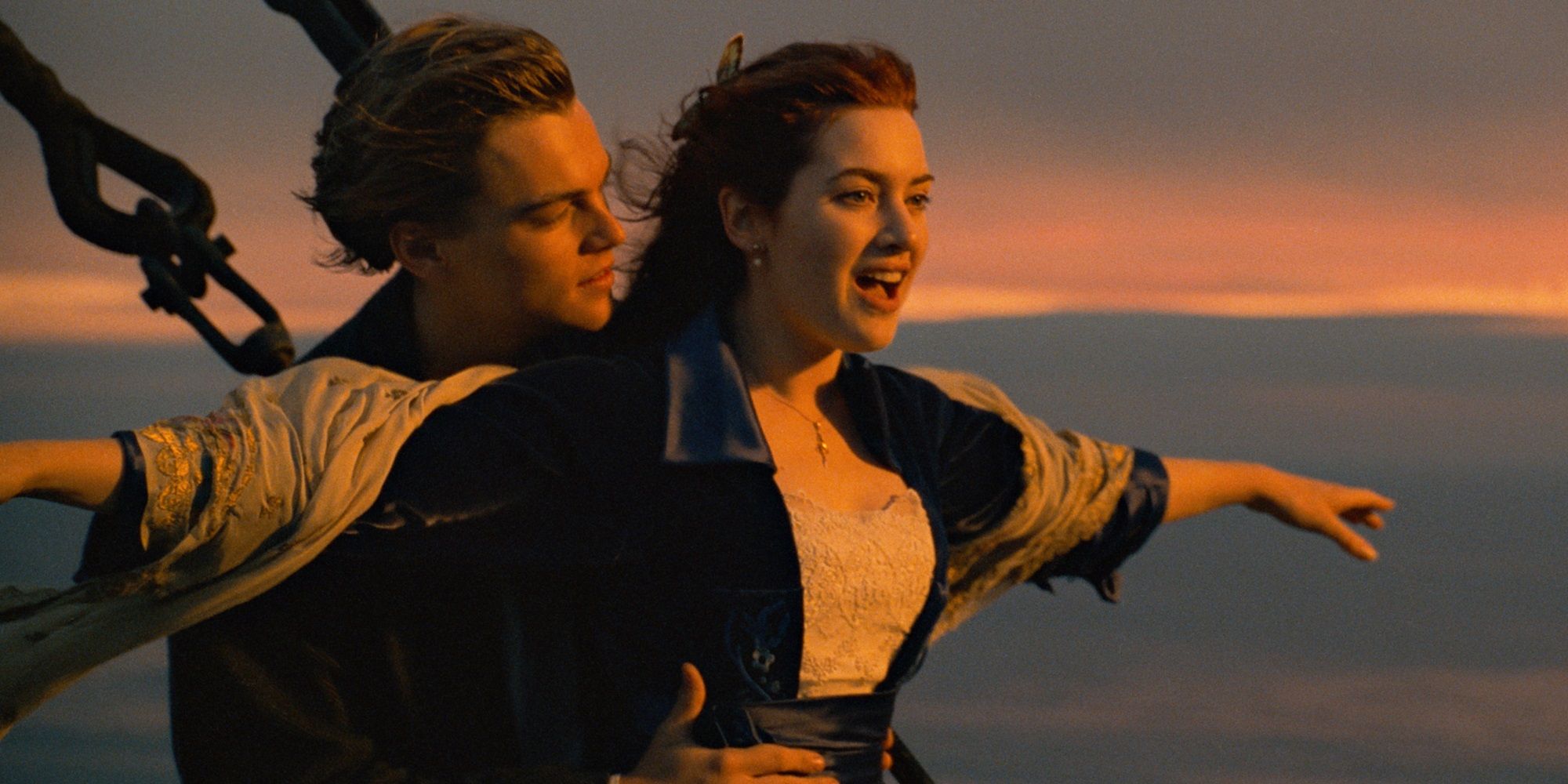 Jack and Rose with her arms out on bow of the boat in Titanic.