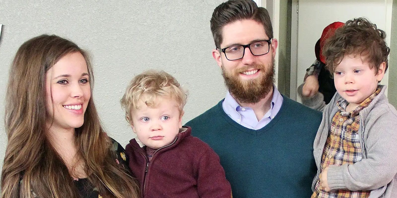 Jessa Duggar from 19 Kids and Counting smiling with her husband and sons