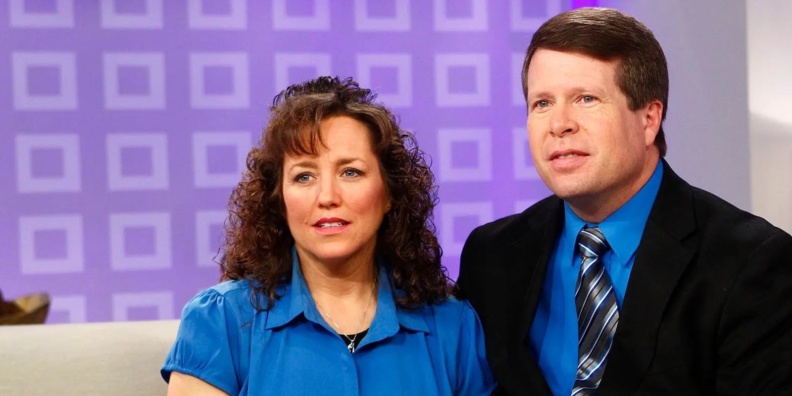 Jim Bob & Michelle Duggar talking to cameras younger days purple background