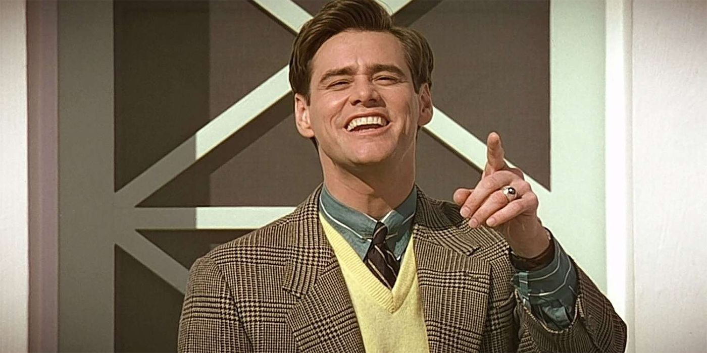 Jim Carrey as Truman Burbank smiling and pointing in The Truman Show.