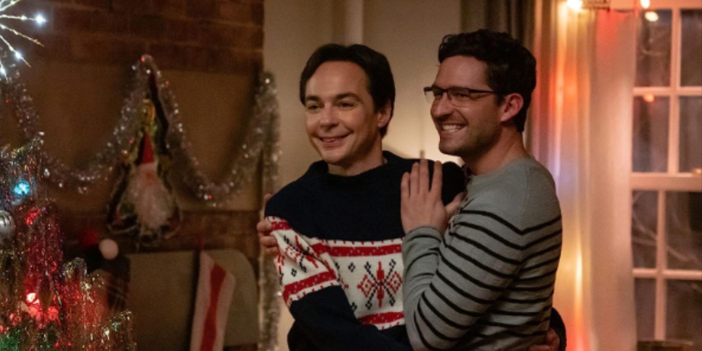 Jim Parsons and Ben Aldridge hugging each other by a Christmas tree in Spoiler Alert