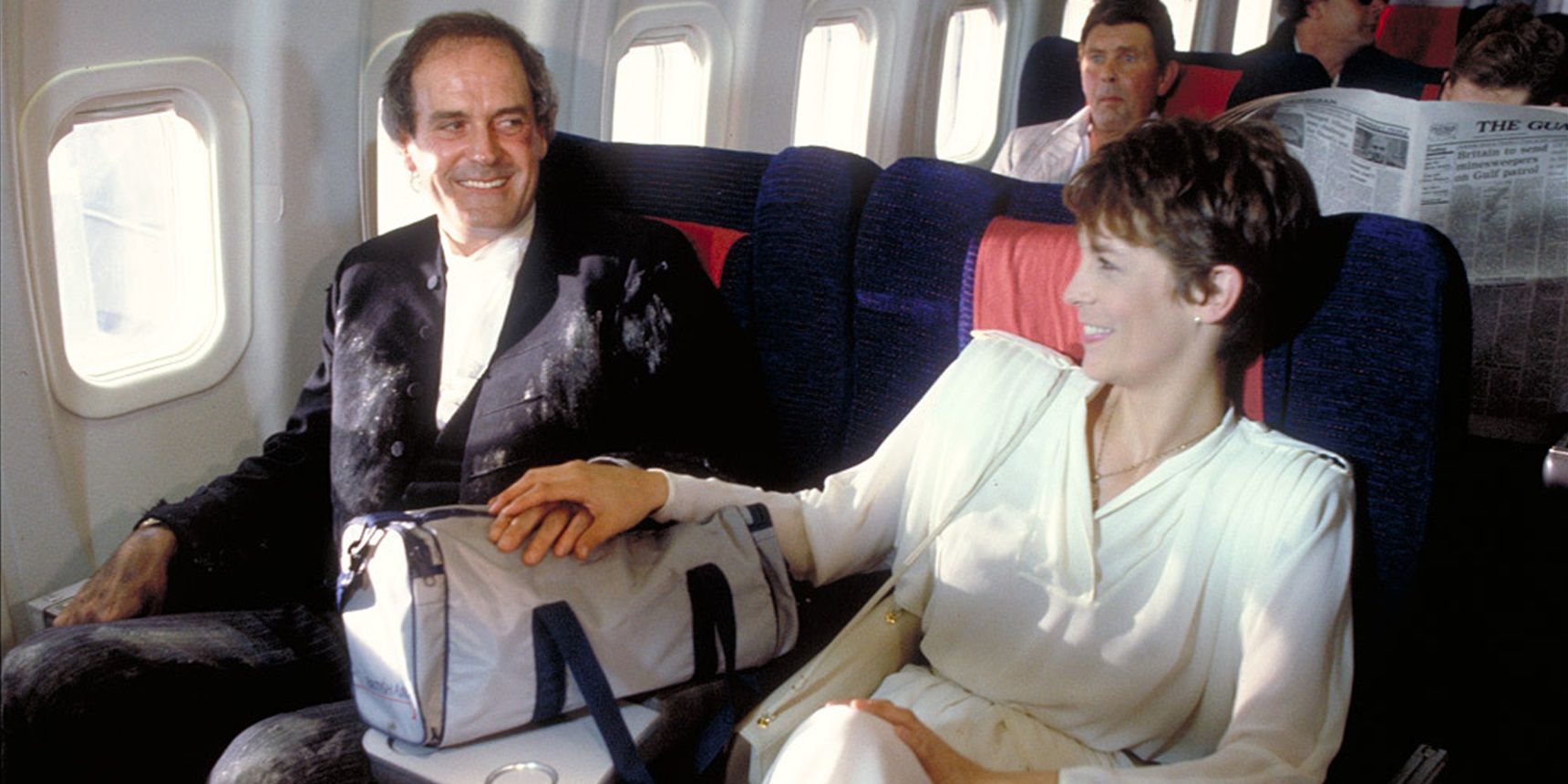 John Cleese and Jamie Lee Curtis on a plane in A Fish Called Wanda