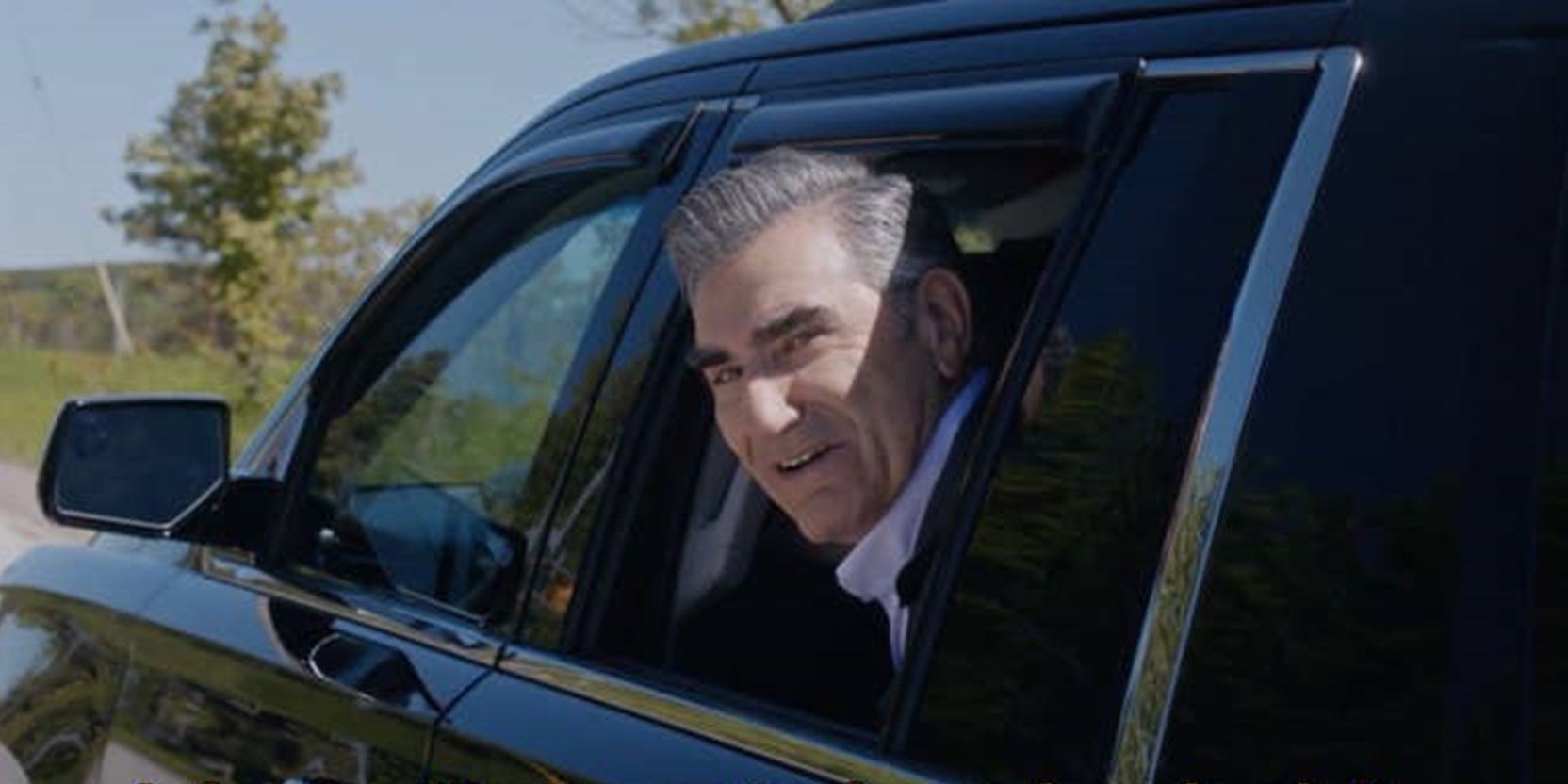 Johnny looks out of a car window in Schitt&rsquo;s Creek