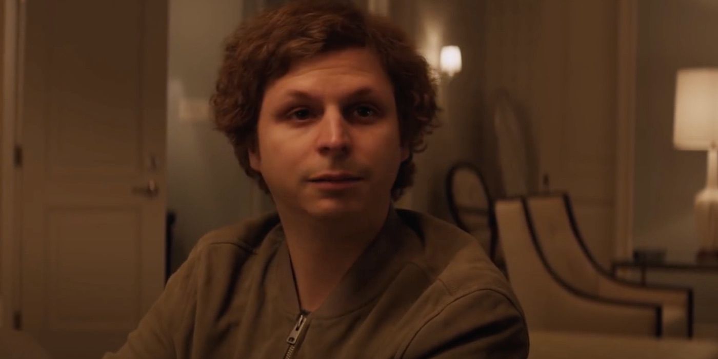 Michael Cera sitting at a poker table in Molly's Game 