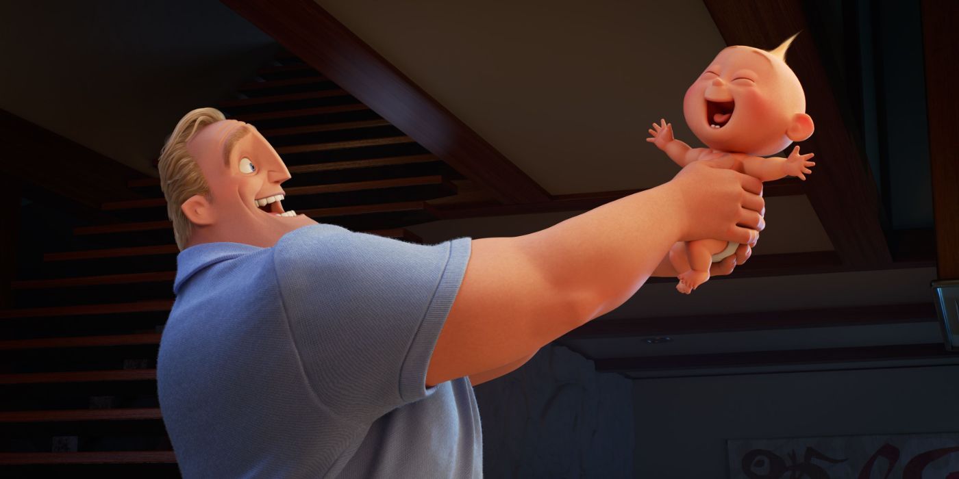 Mr. Incredible smiling and holding up Jak Jak who's laughing.