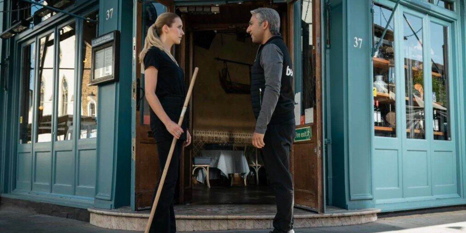 Nate and Jade outside the restaurant in Ted Lasso