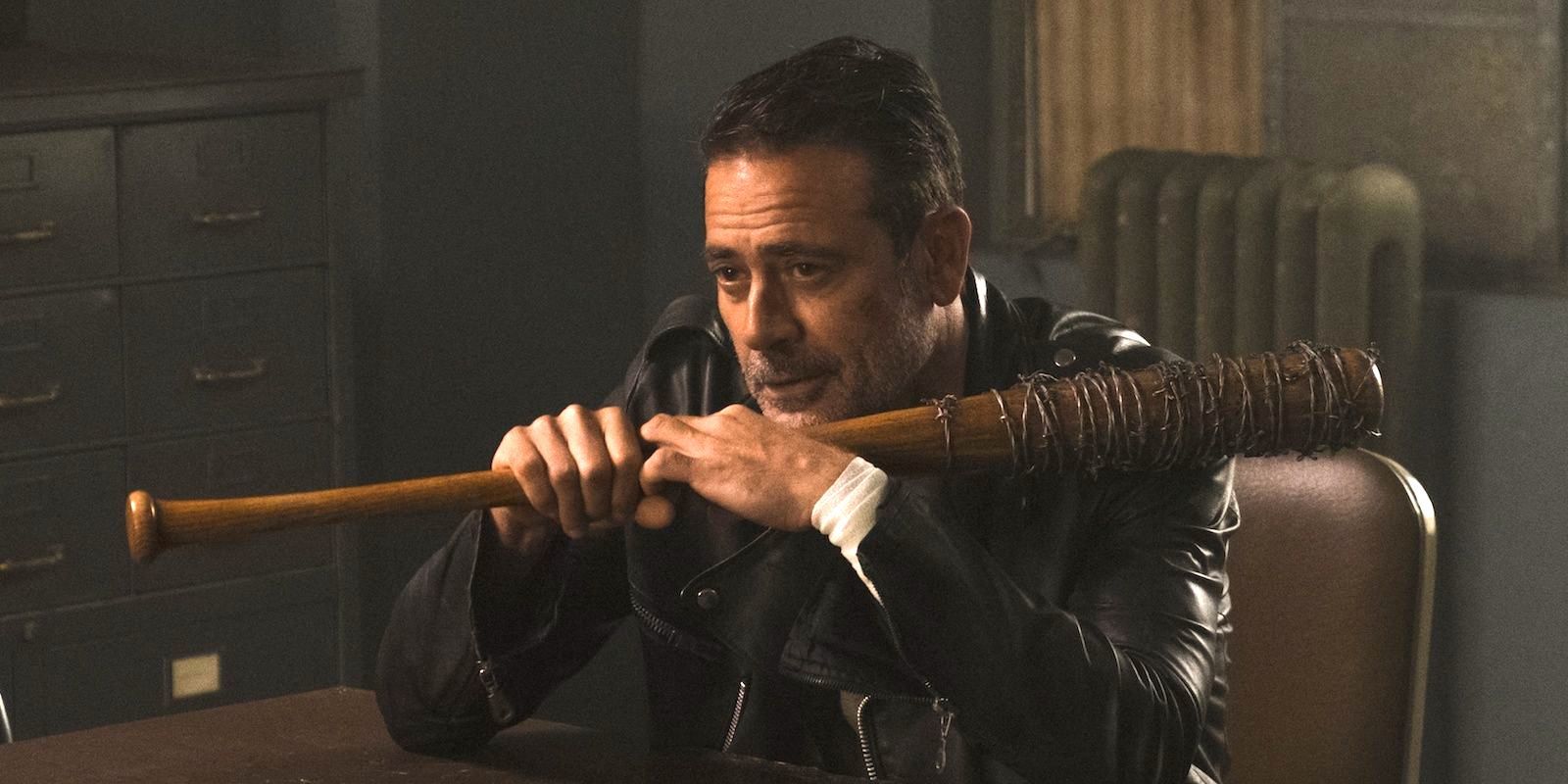 Negan sitting holding Lucille in The Walking Dead