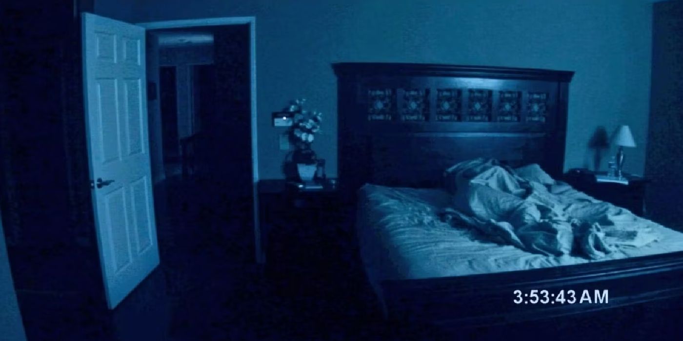 Still from Paranormal Activity showing a bedroom and door open at 3:53 AM