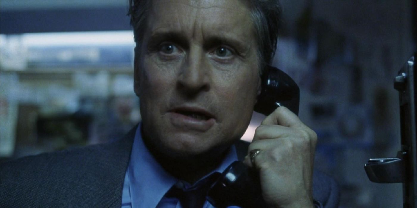 Nicholas Van Orton looks shocked while holding a telephone in The Game