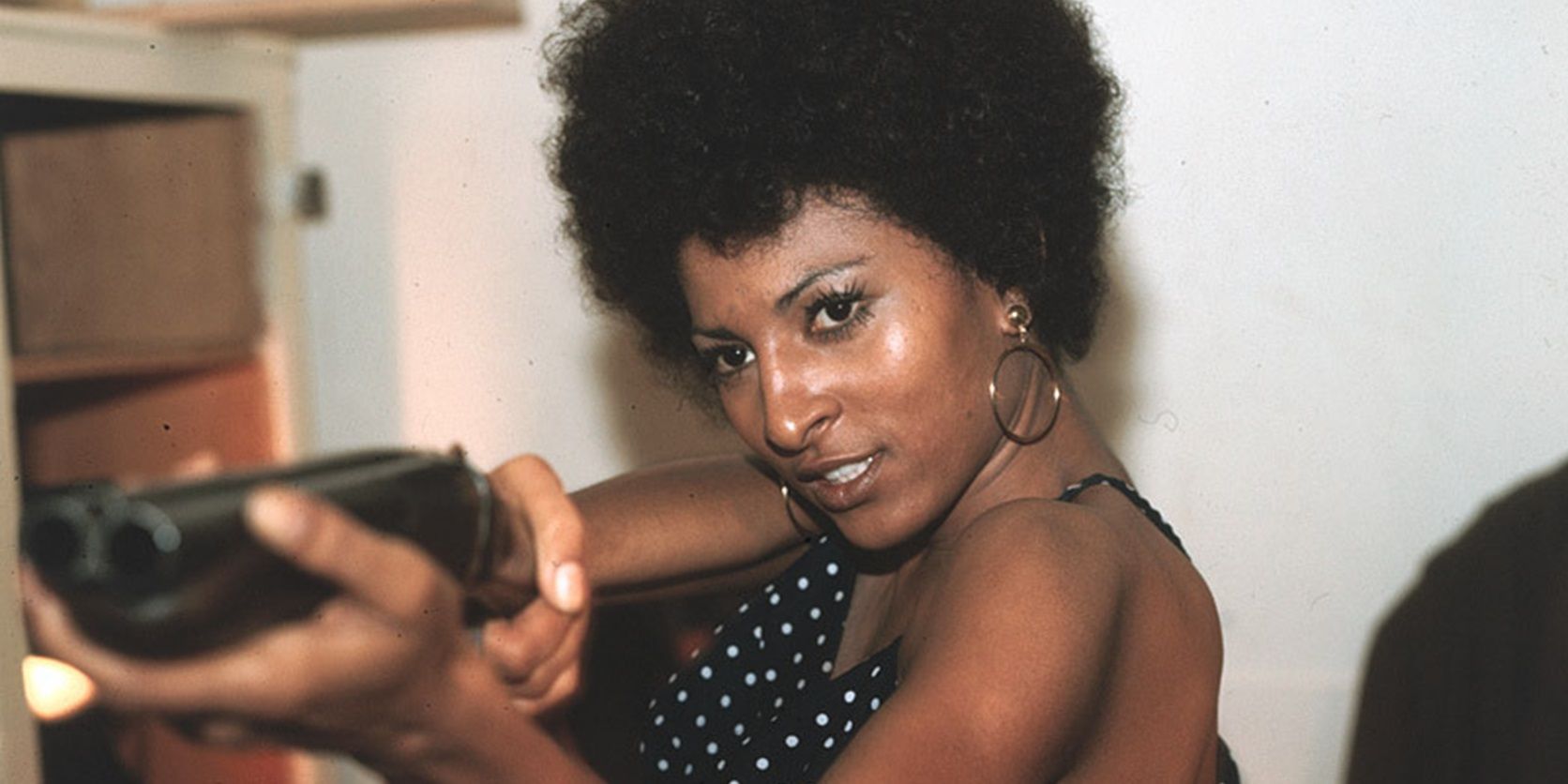 Pam Grier with a shotgun in Coffy