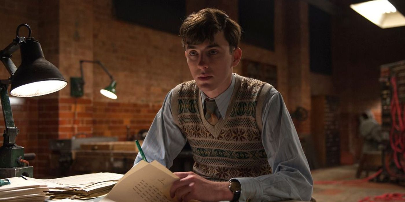 Peter Hilton sitting at a table in The Imitation Game