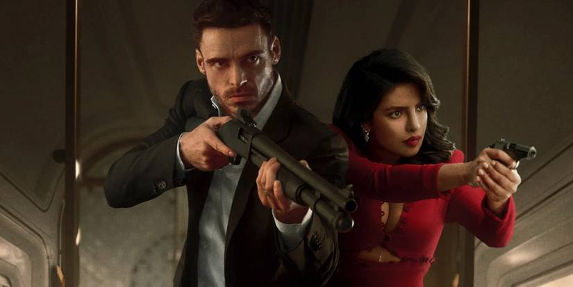Richard Madden and Priyanka Chopra Jonas pointing guns in Citadel