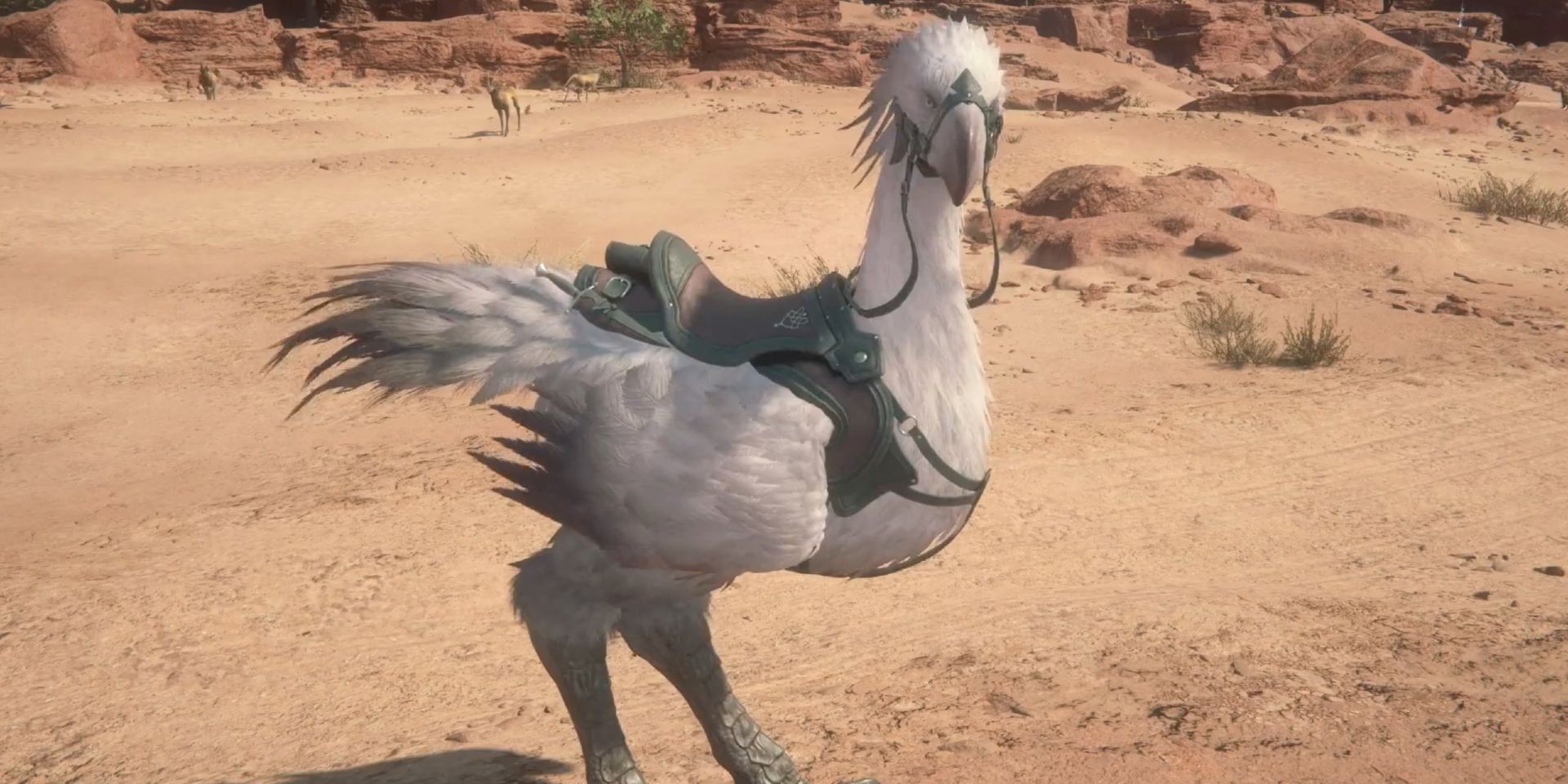 In Final Fantasy 16, Clive's chocobo Ambrosia stands against a sandy desert backdrop. Ambrosia has narrower eyes than a typical chocobo, giving her a stern look.