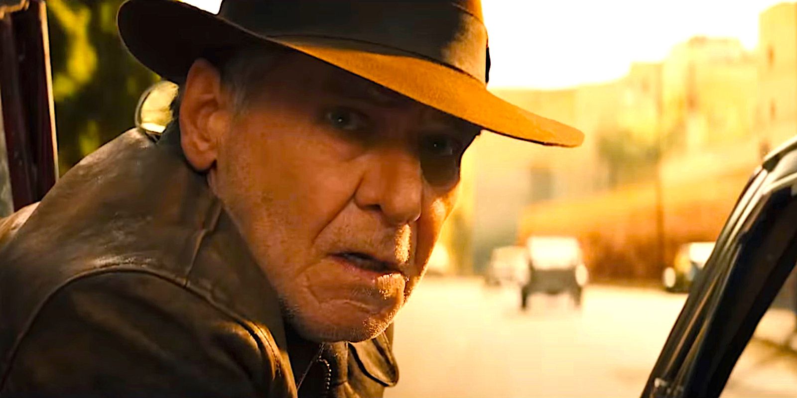 Harrison Ford as Indiana Jones looking shocked in Indiana Jones and the Dial of Destiny