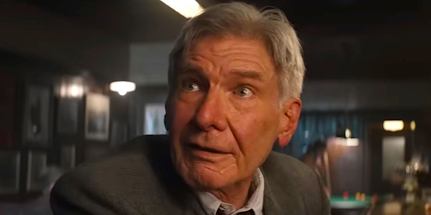 Harrison Ford as Indiana Jones looking happy in Indiana Jones and the Dial of Destiny