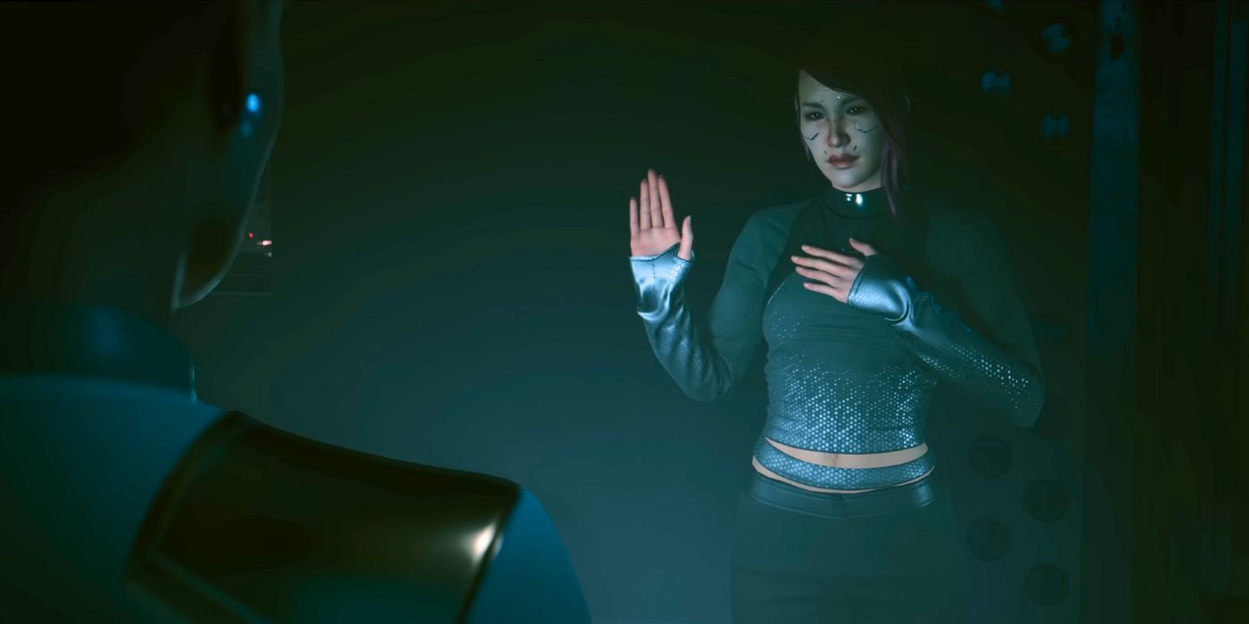 Songbird di Cyberpunk 2077 Phantom Liberty, mengangkat tangan kanannya ke atas dan tangan kirinya di atas jantungnya di depan layar Rosalind Myers.