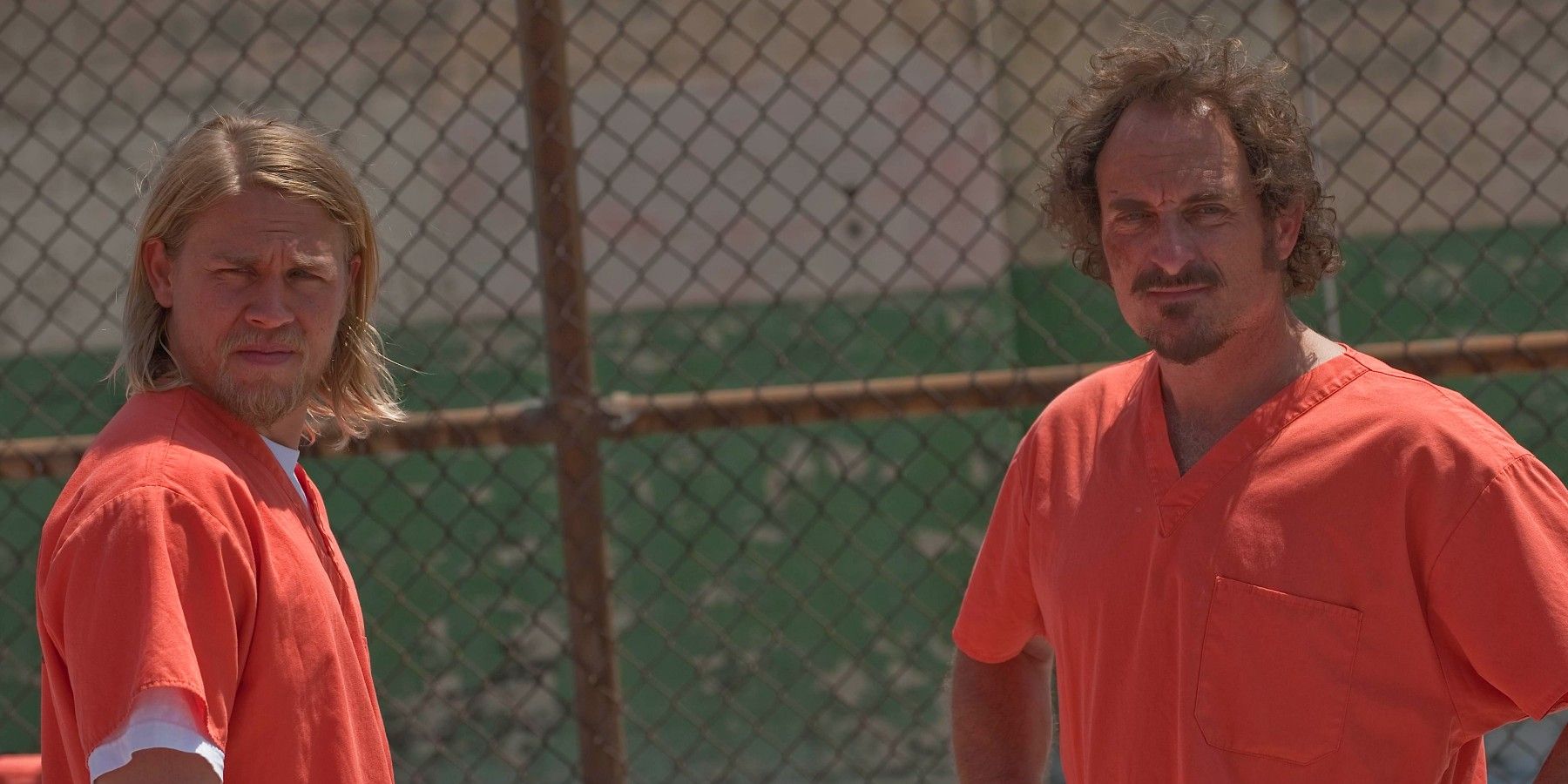 Jax and Tig standing in a prison yard in Sons of Anarchy - Gilead