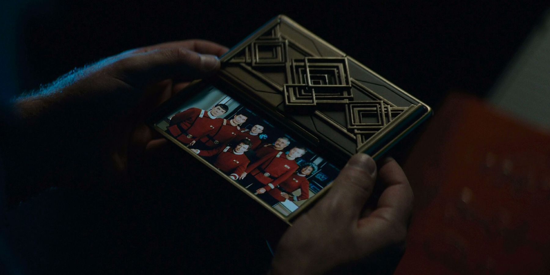 Spock looks at the photo of the older TOS crew in Star Trek Beyond